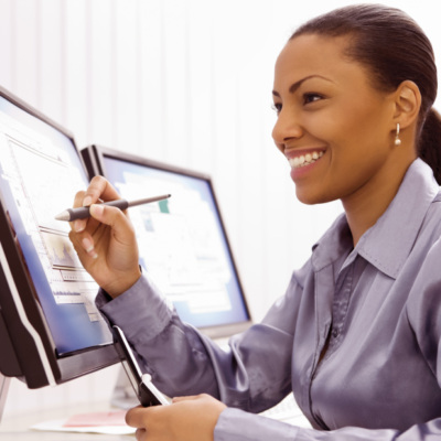 Black-Businesswoman-with-COmputer-and-Cell-Phone Black-Businesswoman-with-COmputer-and-Cell-Phone